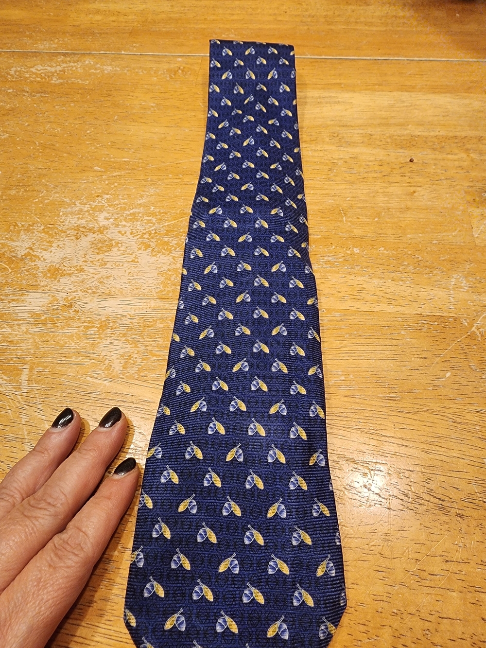 blue silk LOEWE men's tie featuring a small-scale acorn and leaf motif